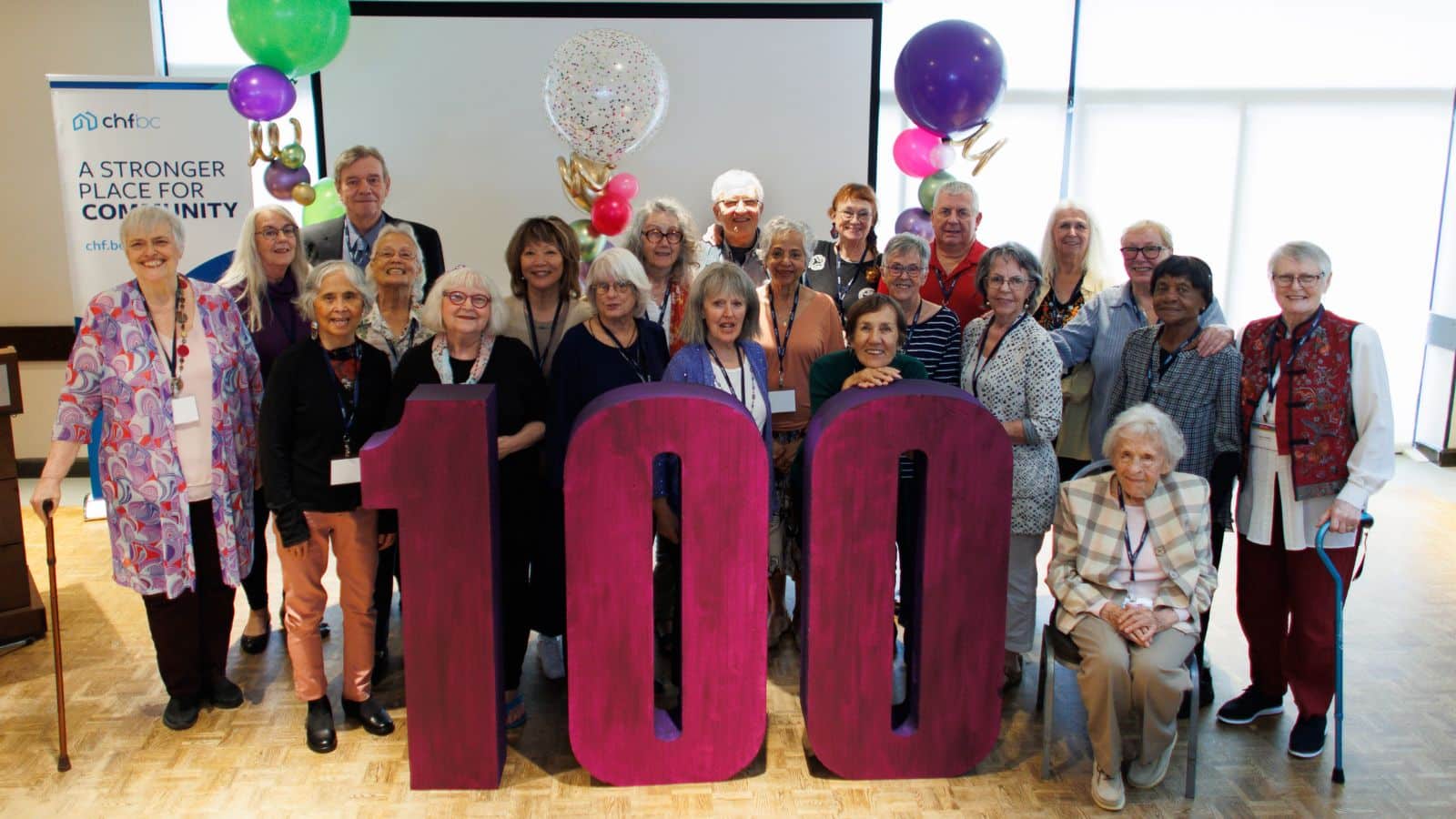 Group holding giant "100" numbers at CHF BC's Century Awards celebration
