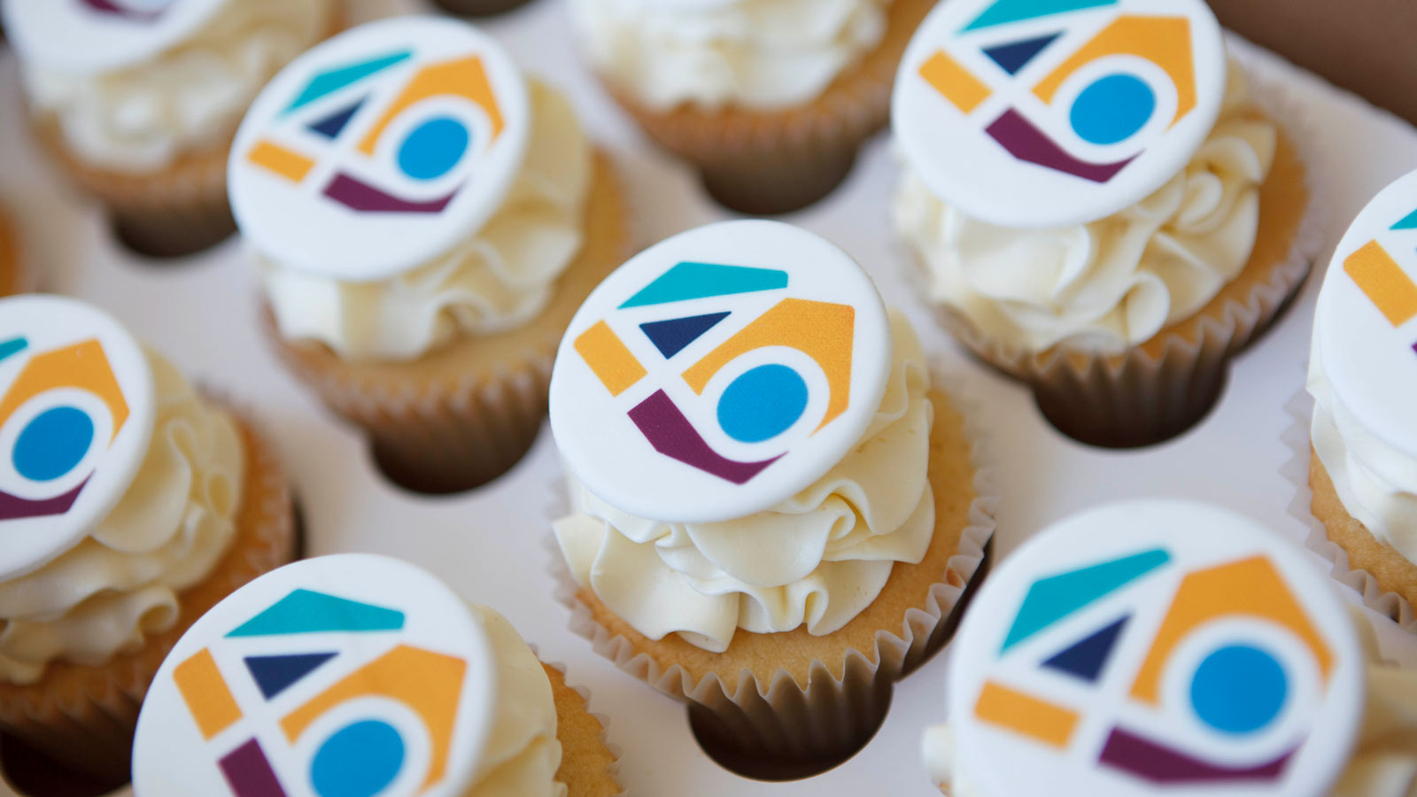 Cupcakes topped with the CHF BC 40th anniversary logo